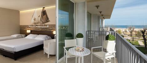 Relax in style with a large bed and seating area, plus a balcony overlooking the beach.