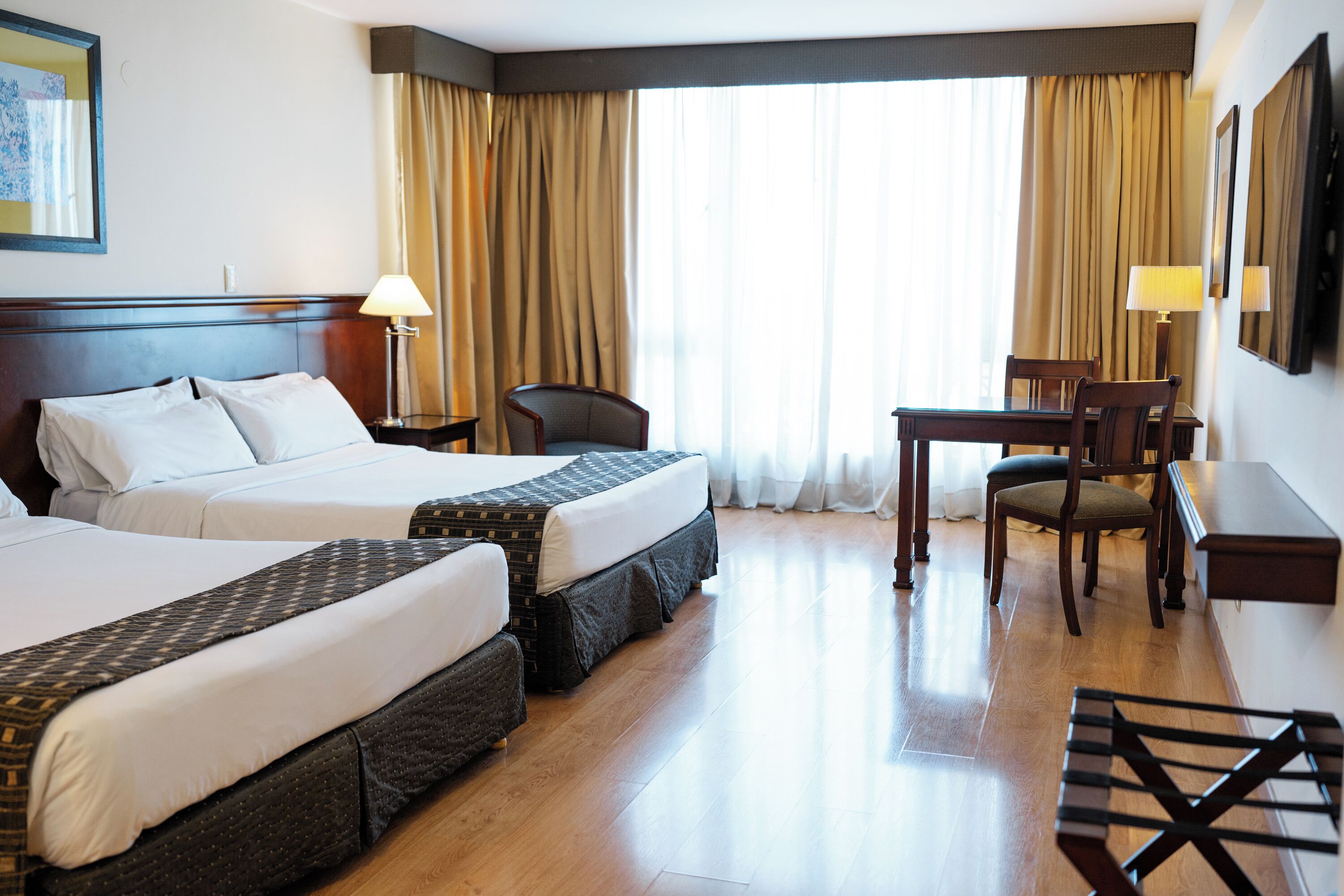 family room | 1 bedroom, minibar, in-room safe, desk