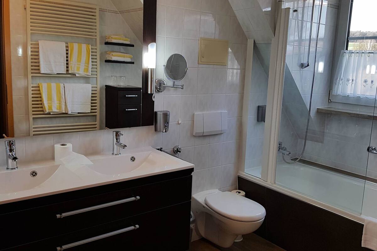bathtub, free toiletries, hair dryer, towels