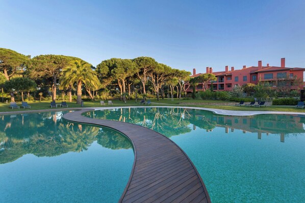 Seasonal outdoor pool, pool umbrellas, pool loungers