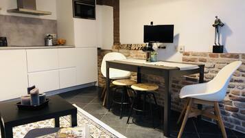 Appartement Confort | Salle de séjour | Télévision à écran plat