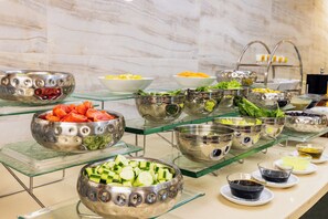 A buffet with various food items and condiments. - Elite Hotel Dragos (Istanbul)