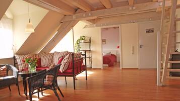 Maisonette Suite | Living area | Flat-screen TV