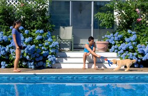 Seasonal outdoor pool, open 8:00 AM to 10:00 PM, pool umbrellas