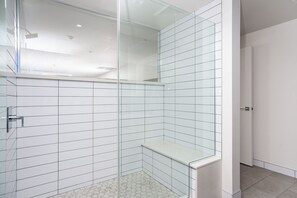 Luxury Studio Suite | Bathroom | Shower, designer toiletries, hair dryer, towels