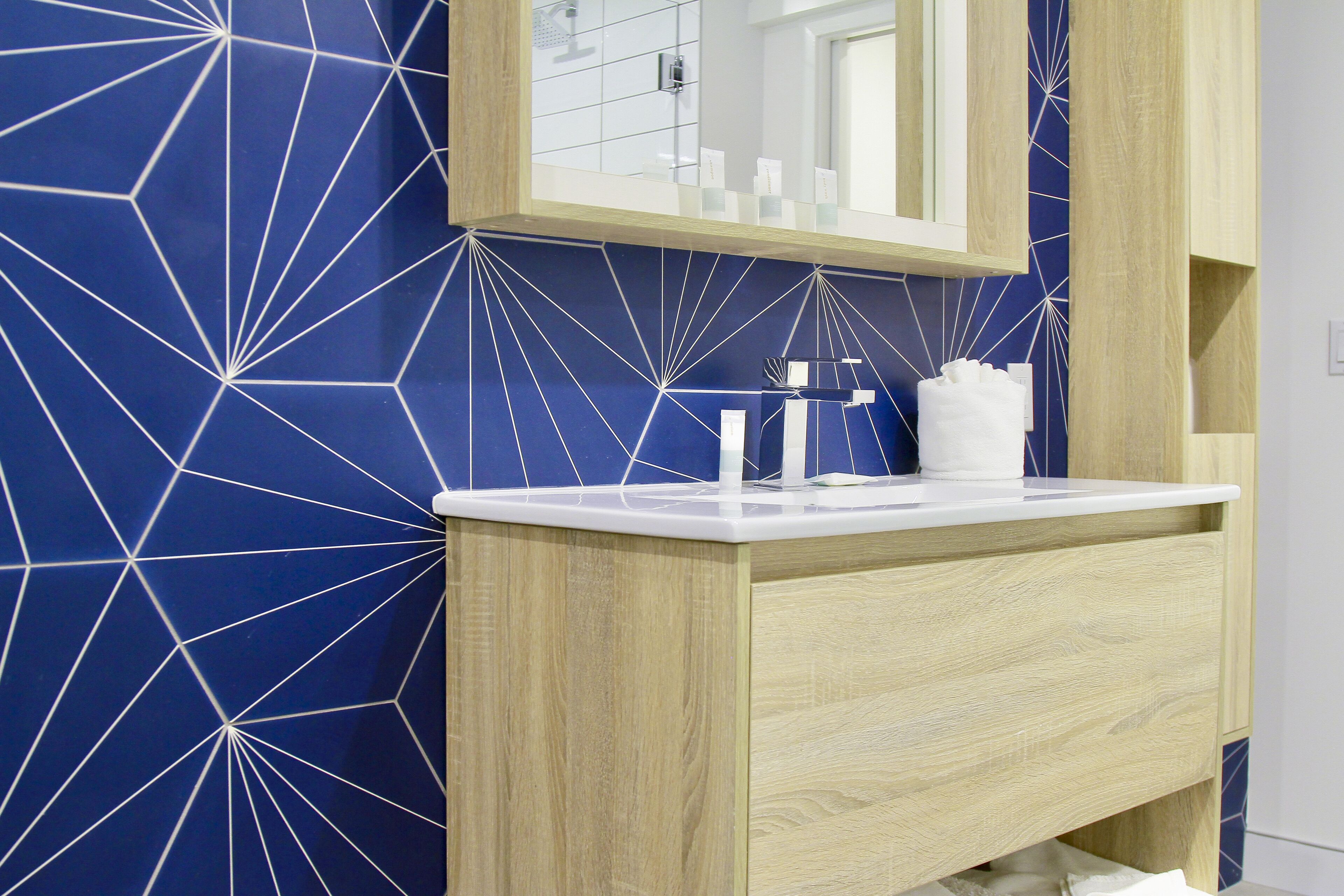 luxury studio suite | bathroom | shower, designer toiletries, hair dryer, towels