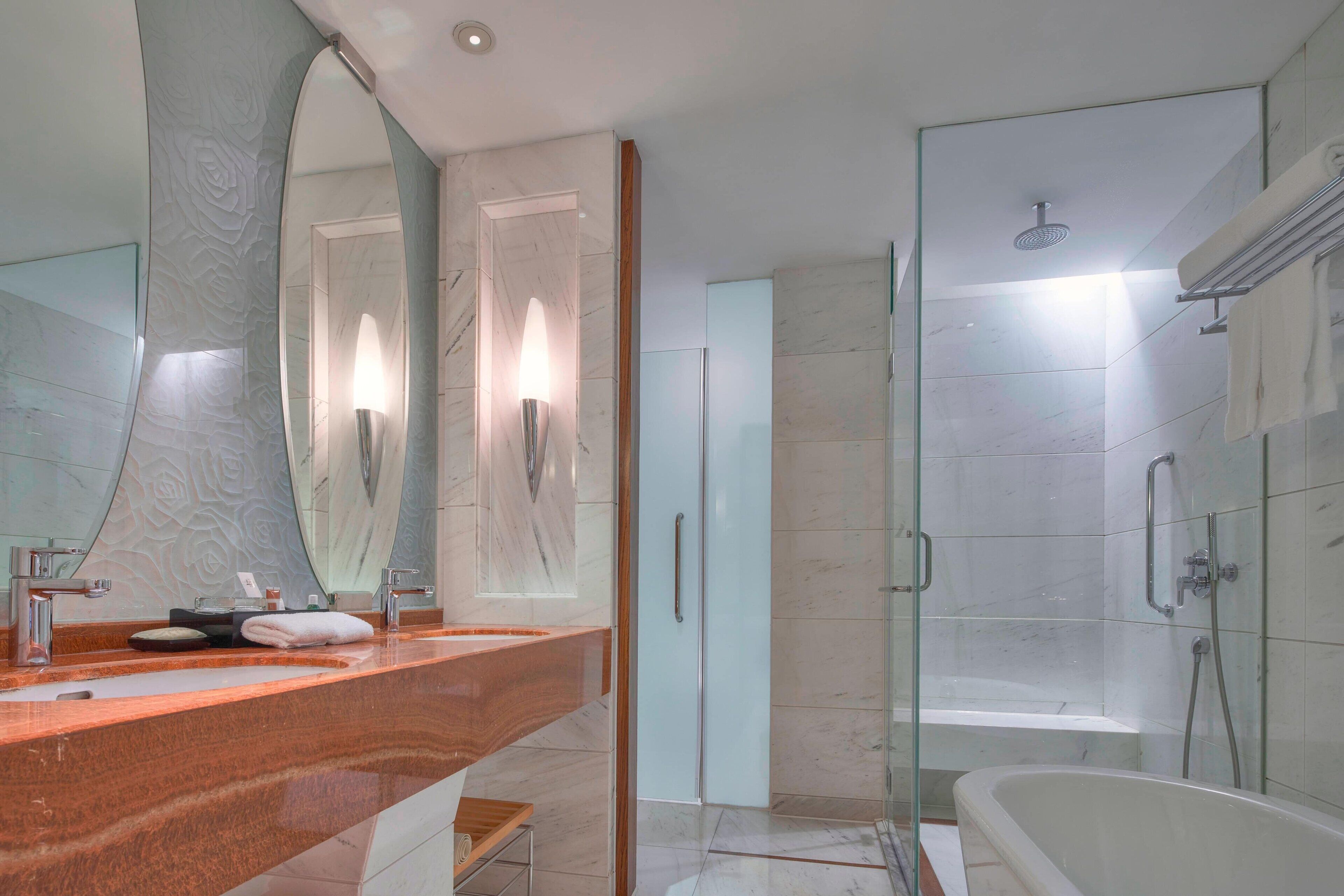 separate bathtub and shower, deep-soaking bathtub, rainfall showerhead