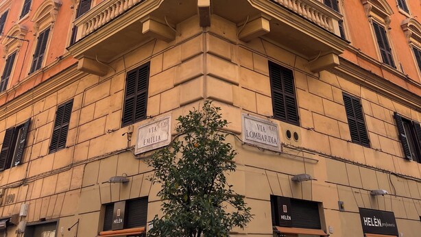 A corner building with classical architecture, featuring a prominent balcony and multiple windows. - Hotel Garda (Rome)