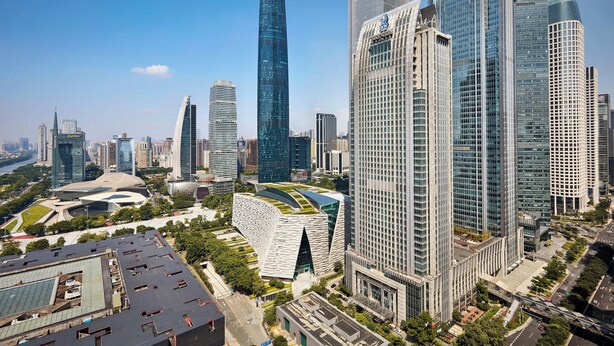 A high-rise urban area with modern skyscrapers, including a distinctive building with a unique, curved facade.