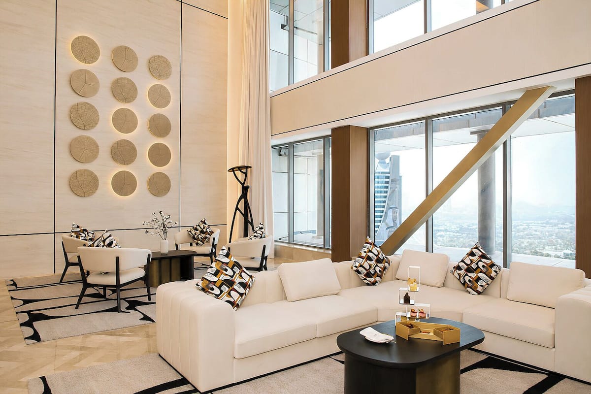 A modern living room with a sofa, coffee table, and decorative wall art.