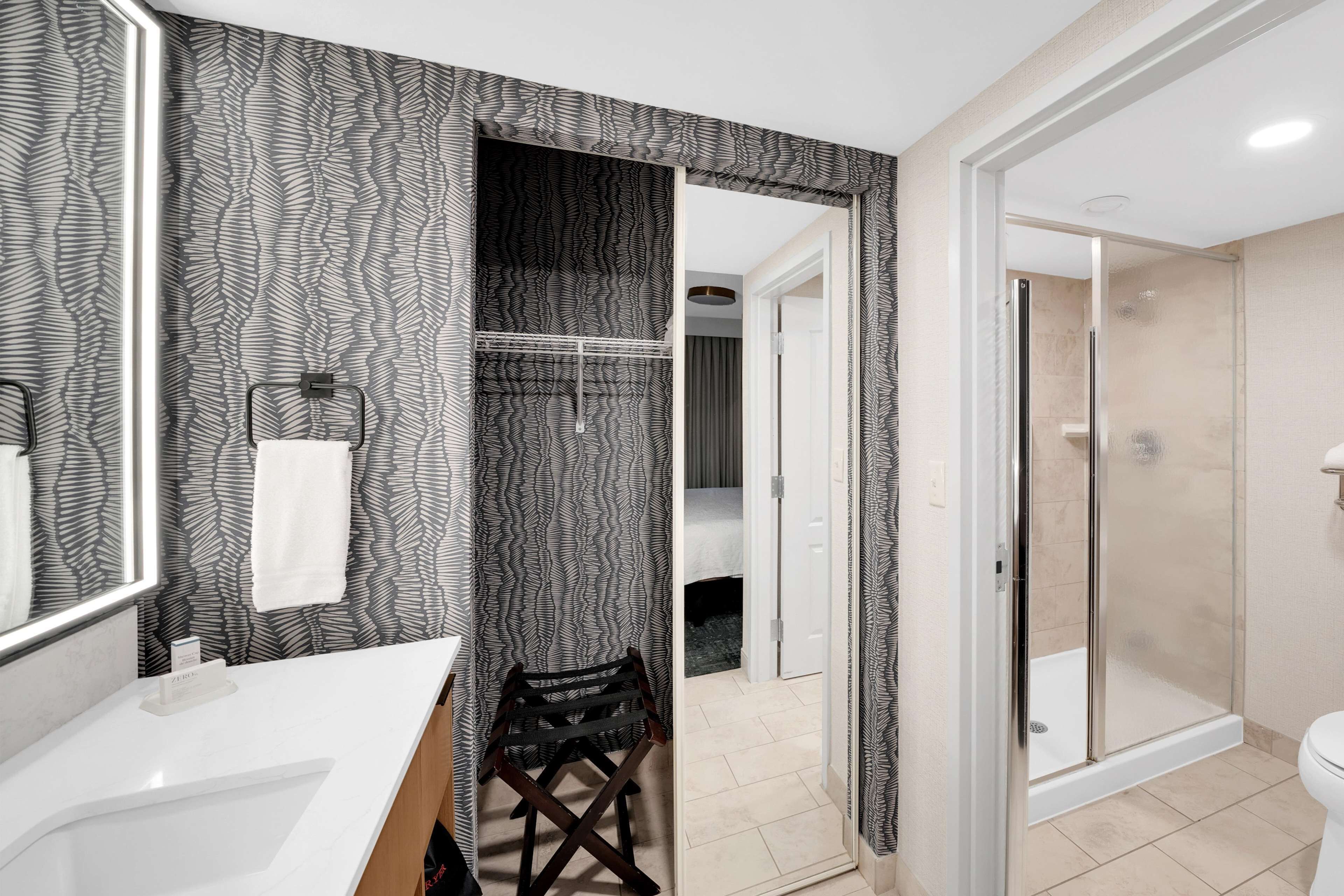 studio suite, 2 queen beds | bathroom | free toiletries, hair dryer, towels