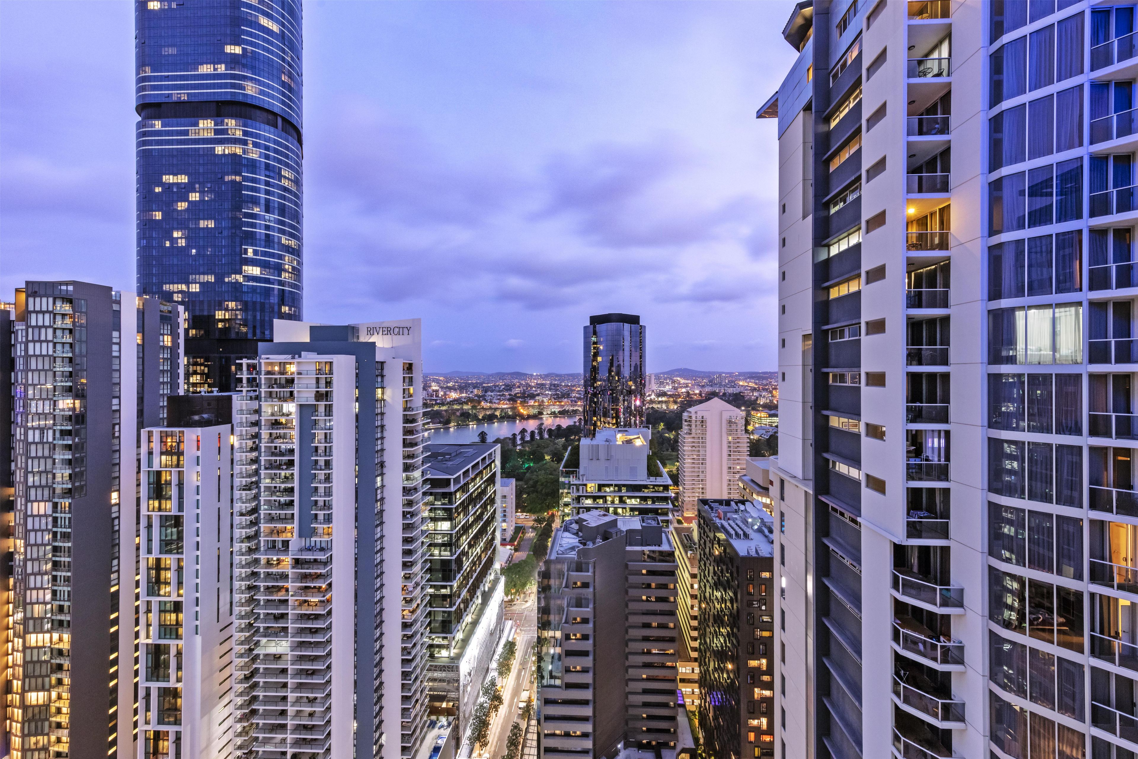 A high-rise building with multiple floors, large windows, and a modern architectural design.