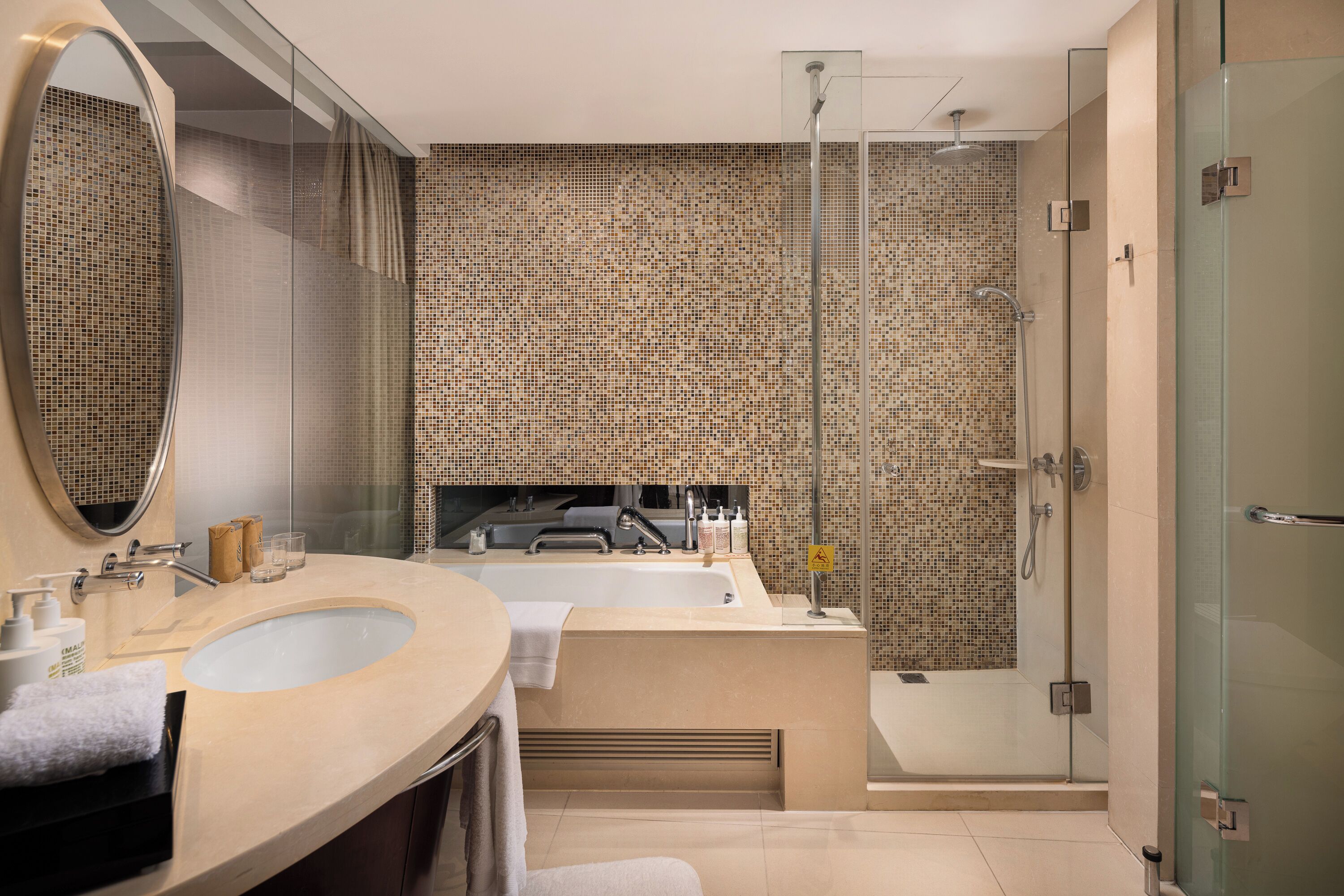 deluxe twin room | bathroom | separate bathtub and shower, designer toiletries, hair dryer, bathrobes