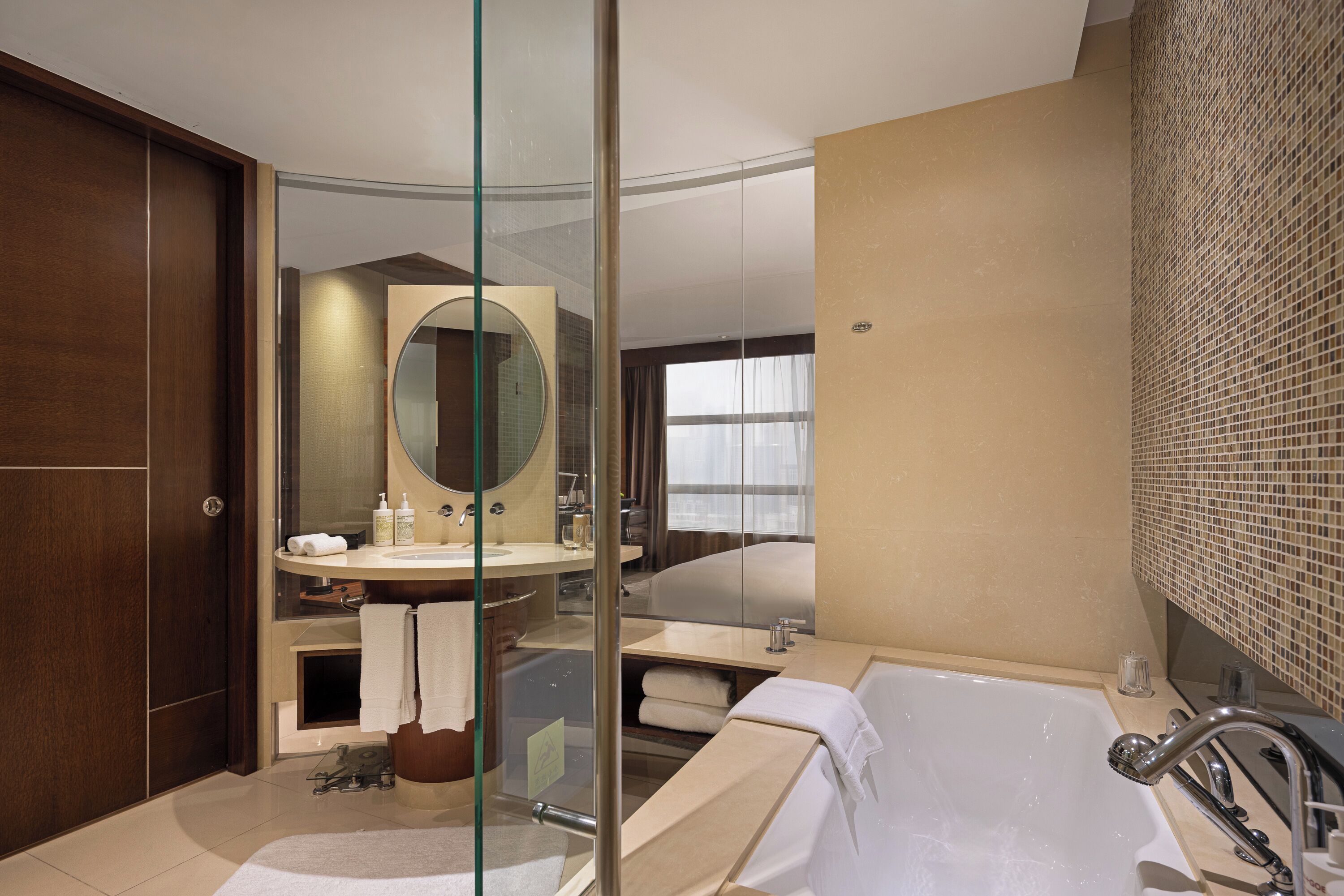 separate bathtub and shower, designer toiletries, hair dryer, bathrobes