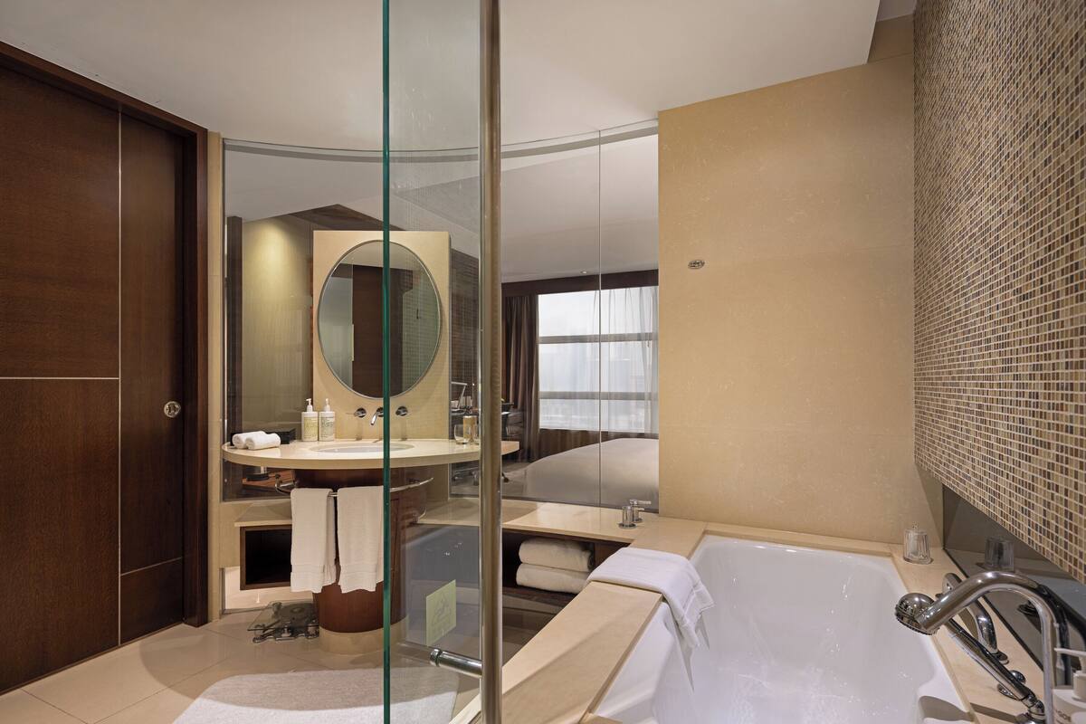 separate bathtub and shower, designer toiletries, hair dryer, bathrobes