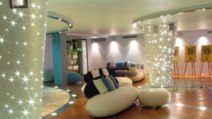 A modern interior with unique seating arrangements and a glass floor.