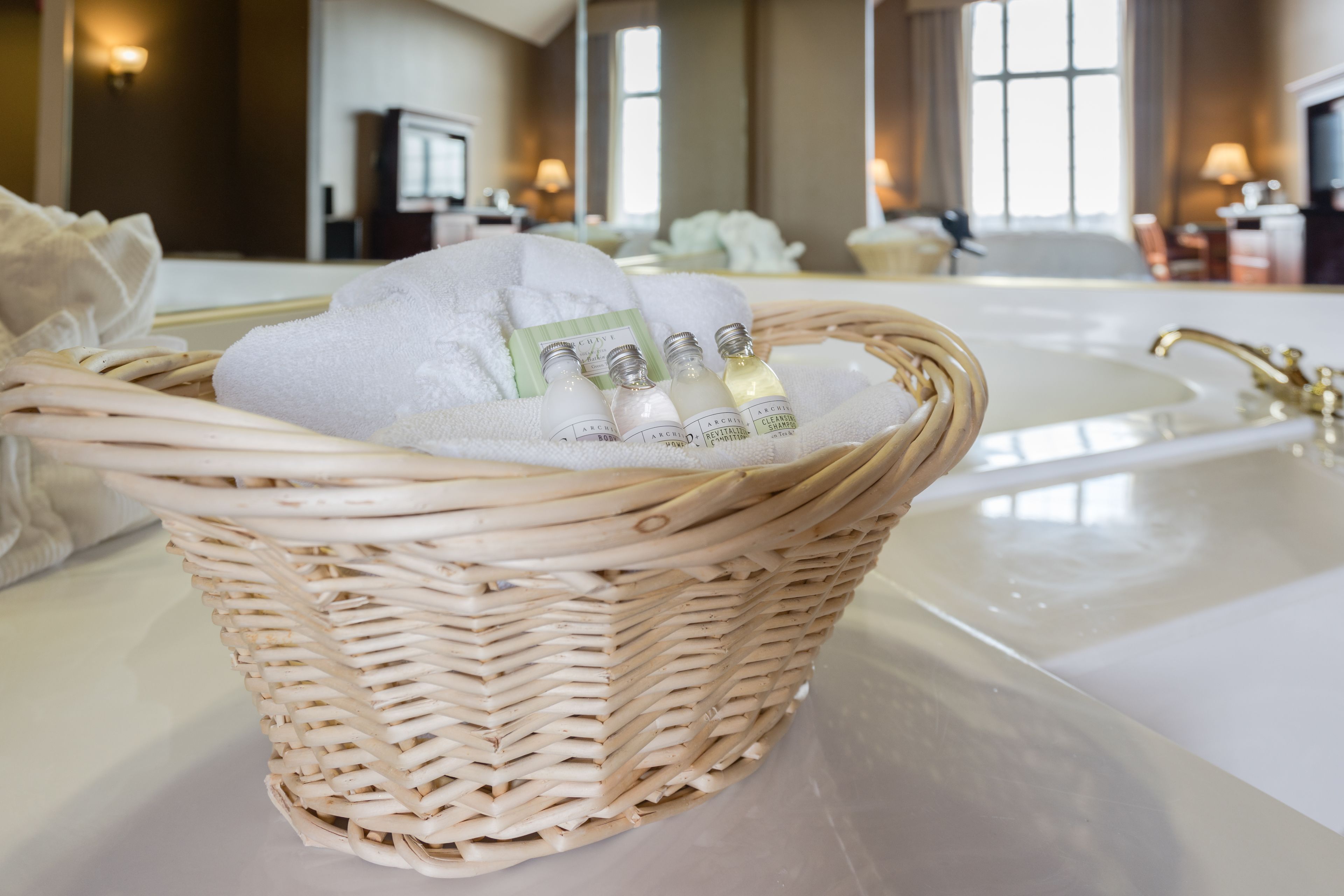 combined shower/bathtub, designer toiletries, hair dryer, towels