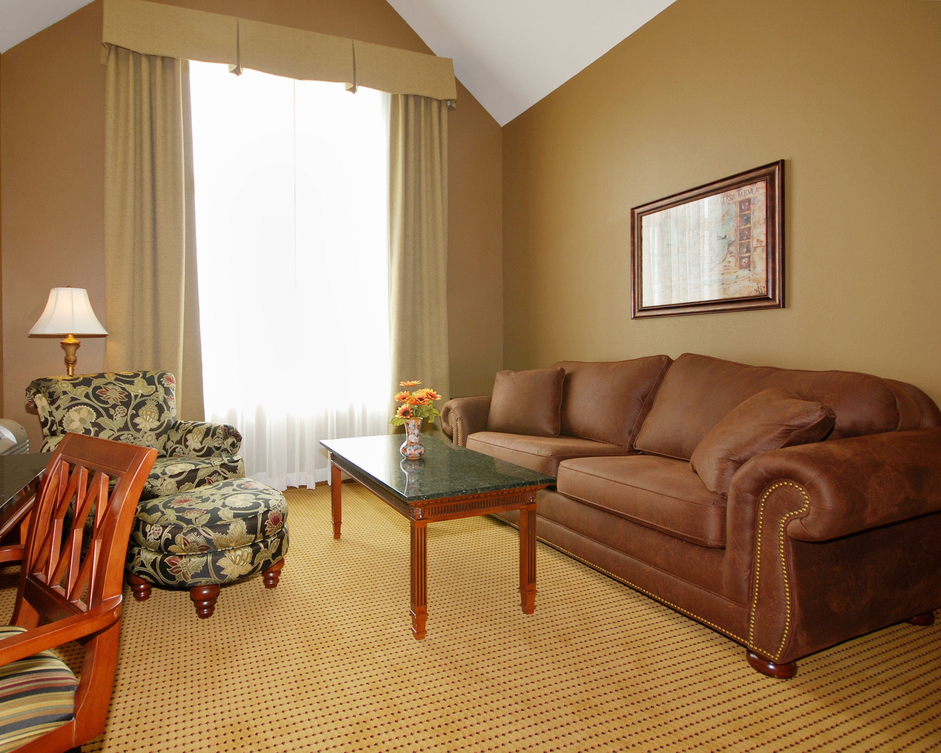 standard room, 1 king bed with sofa bed | living room | 32-inch lcd tv with cable channels, tv, mp3 dock