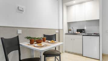 Superior Suite, Kitchenette | Private kitchen | Fridge, stovetop, electric kettle, cookware/dishes/utensils