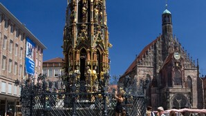 A historic church with intricate architecture and a prominent spire. - Hotel Metropol Nürnberg (Nuremberg)