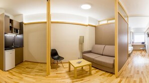 Standard Suite, Kitchenette | Living room | 28-inch flat-screen TV with digital channels, TV - Bonanova Suite Hotel (Barcelona)