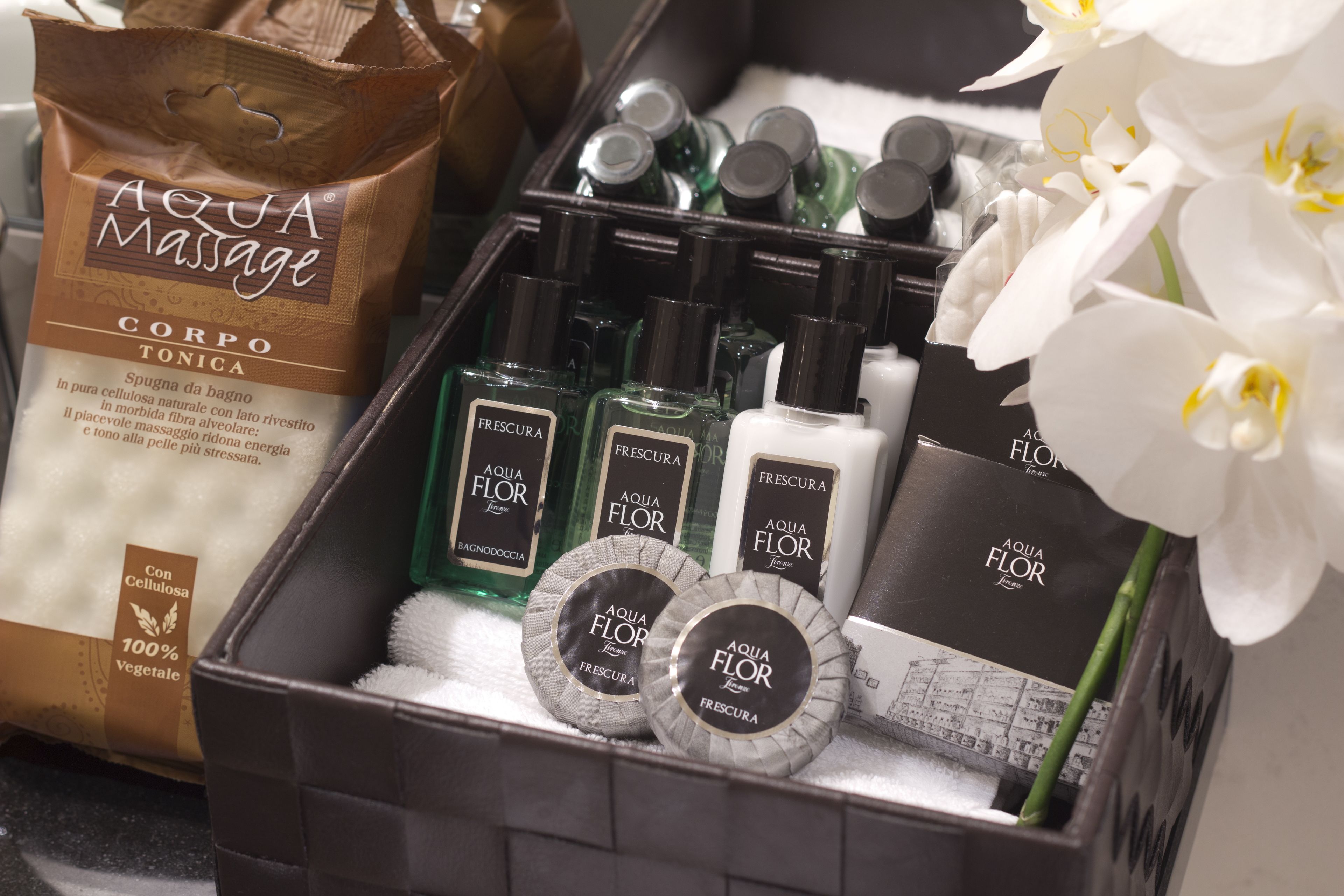 A spa gift set with Aqua Flor products, including body lotion and body wash.