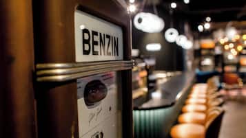 A vintage elevator with a sign reading "BENZIN" and a D- Mark logo.