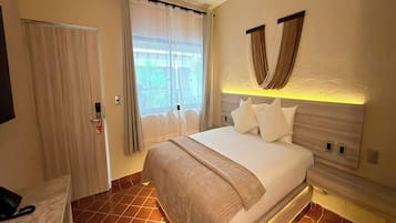 Quarto luxo | Roupas de cama premium, cofres nos quartos, Wi-Fi de cortesia