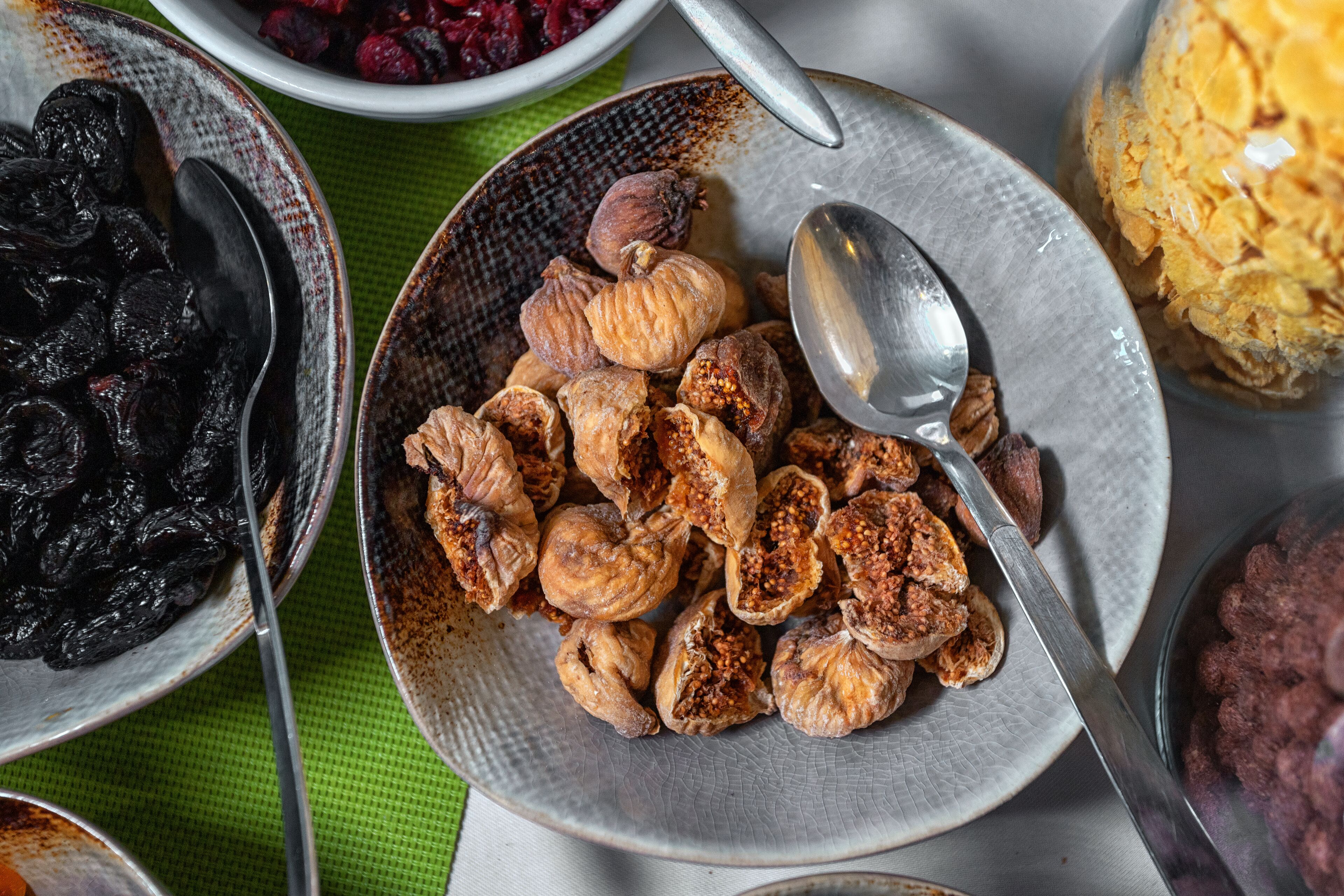 A variety of dried fruits and nuts on a table.