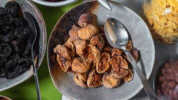 A variety of dried fruits and nuts on a table.
