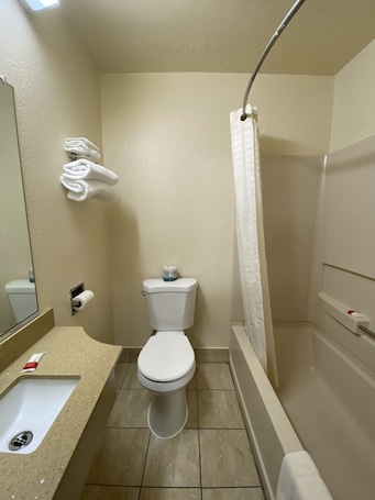 Combined shower/bathtub, hair dryer, towels. Lodge Inn