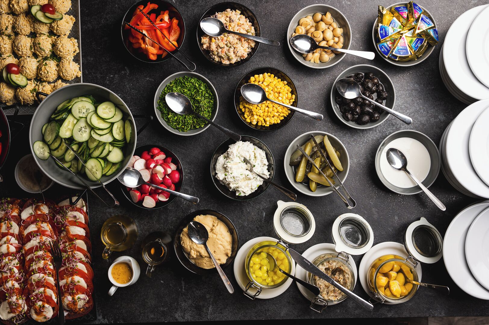 A variety of food items and condiments arranged on a table.