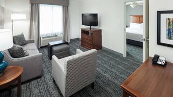 Premium bedding, desk, laptop workspace, blackout curtains