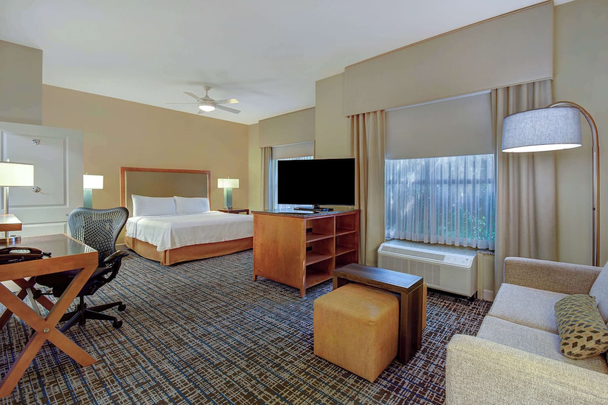 Studio, 1 King Bed, Accessible (Mobility & Hearing, Roll-in Shower) | Living area | 55-inch LCD TV with cable channels, TV, DVD player