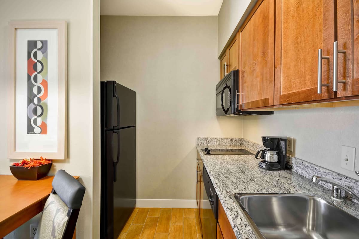 full-sized fridge, microwave, stovetop, dishwasher