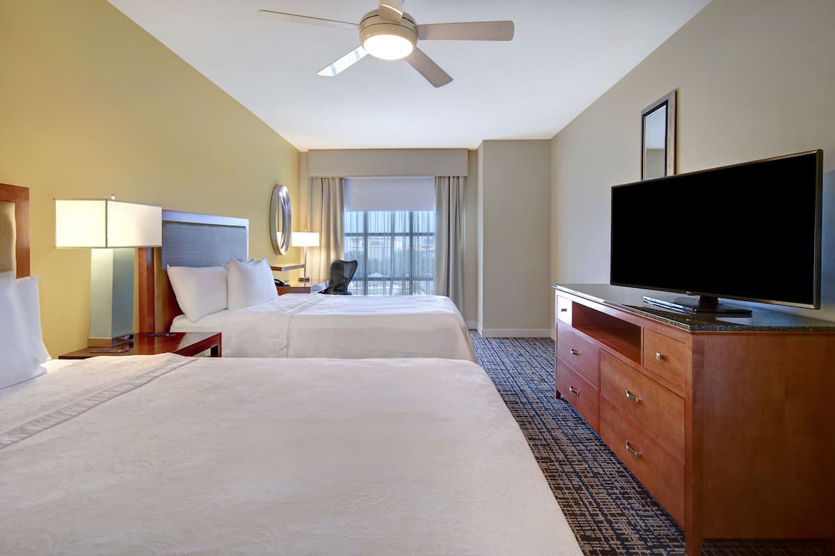 suite, 2 queen beds, accessible, bathtub (mobility & hearing) | 1 bedroom, laptop workspace, iron/ironing board, free cots/infant beds