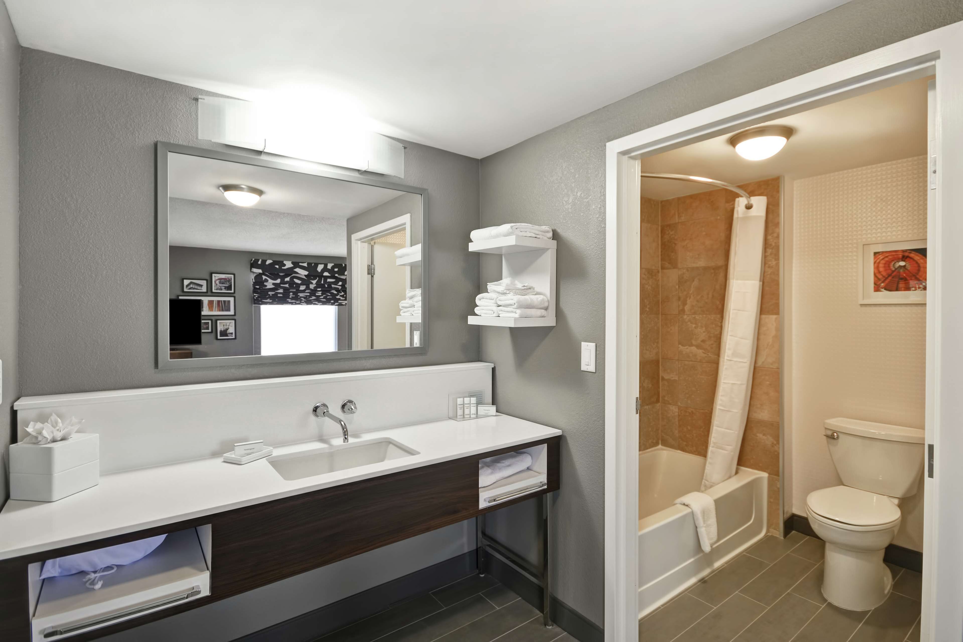 designer toiletries, hair dryer, towels, soap