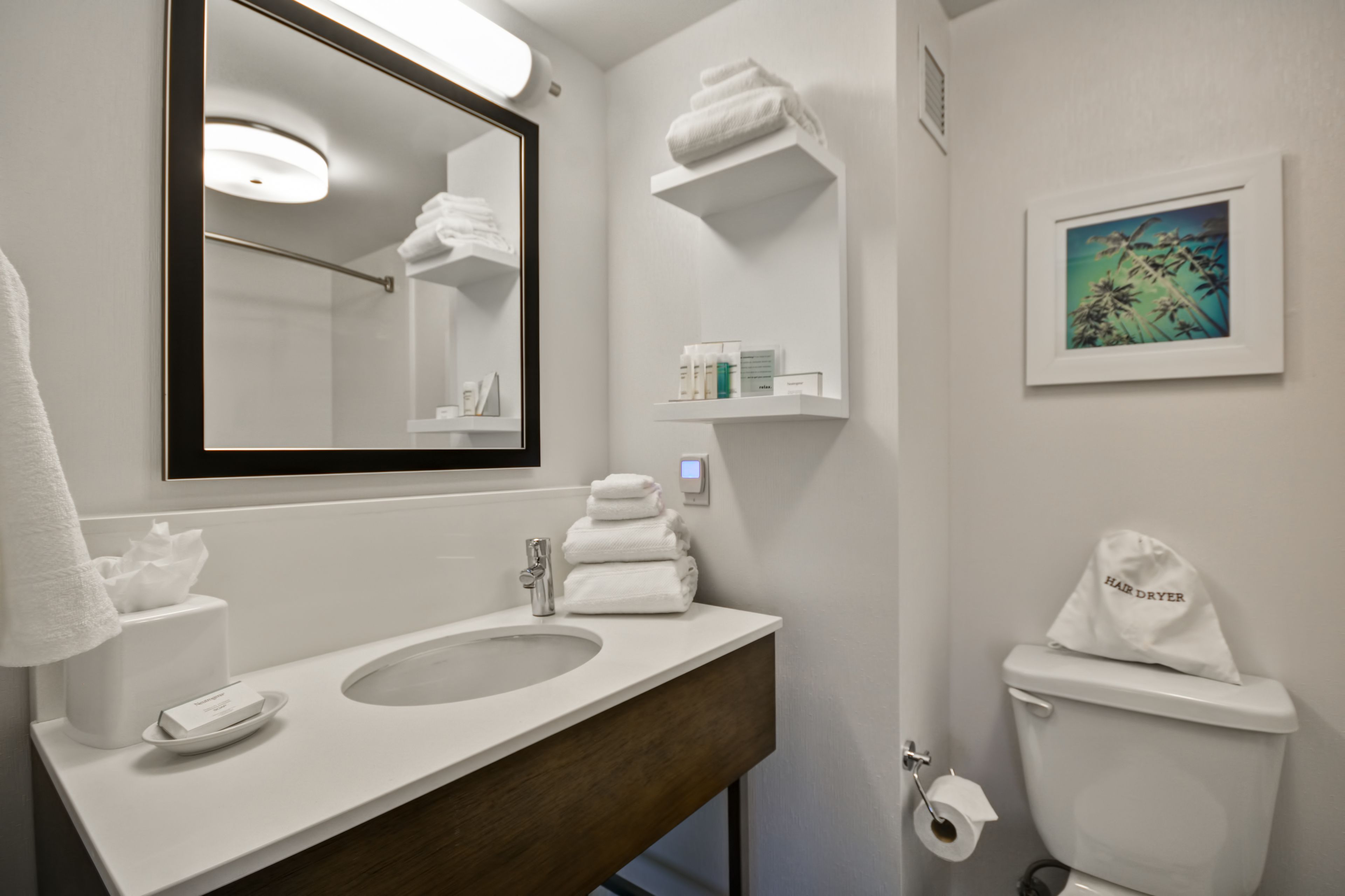 combined shower/bathtub, designer toiletries, hair dryer, towels