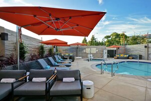 Outdoor pool, open 9:00 AM to 10:00 PM, free cabanas, pool umbrellas
