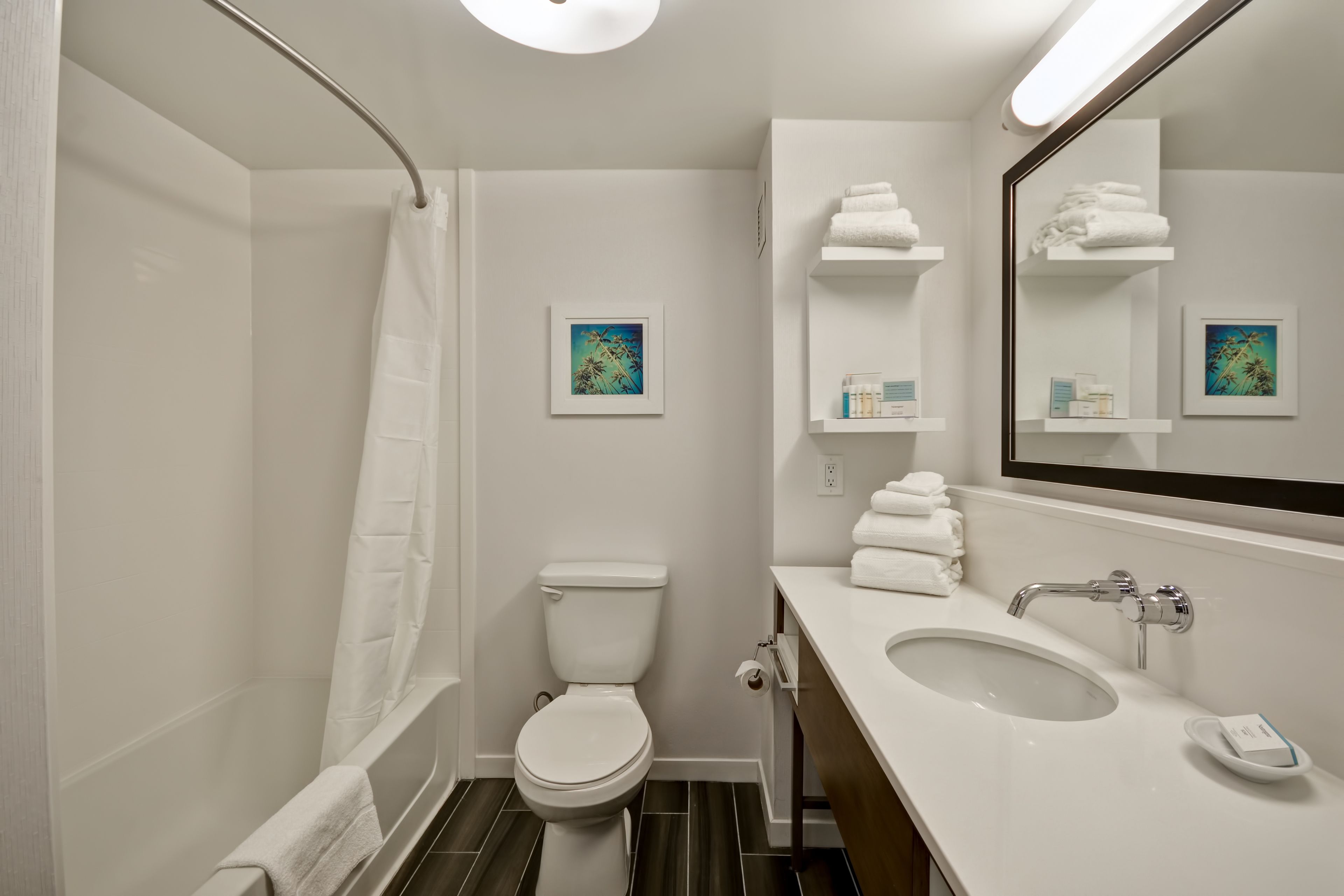 combined shower/bathtub, designer toiletries, hair dryer, towels