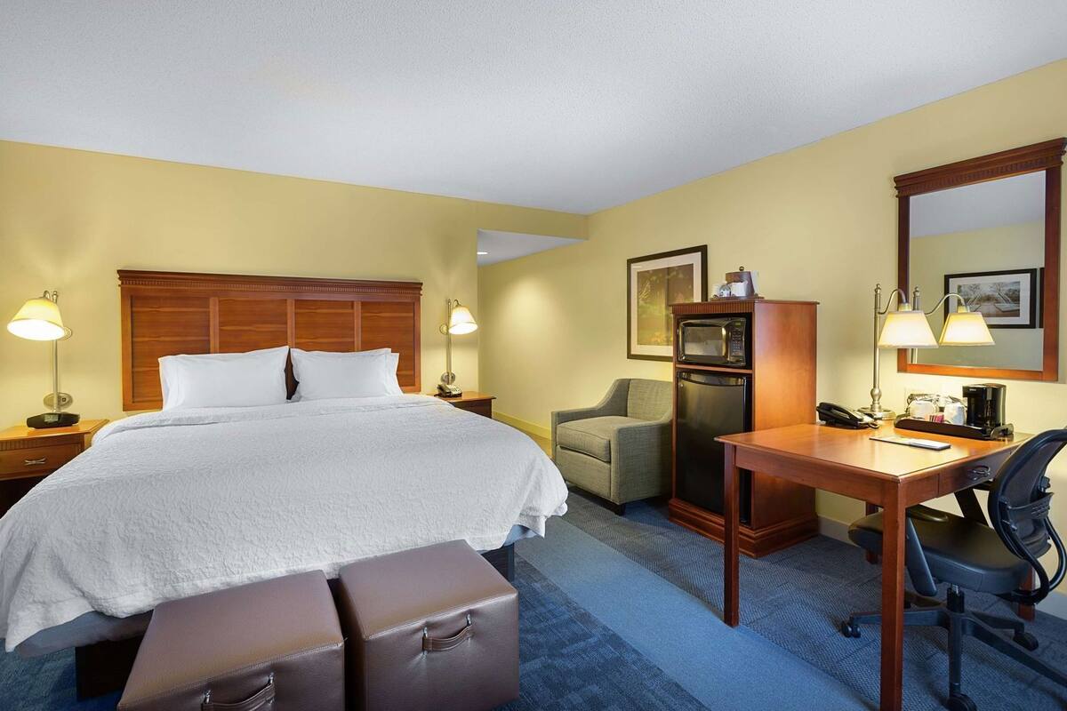 Desk, laptop workspace, blackout curtains, iron/ironing board