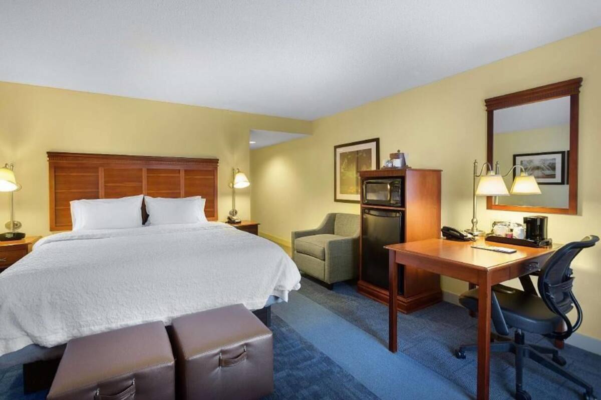 Desk, laptop workspace, blackout curtains, iron/ironing board