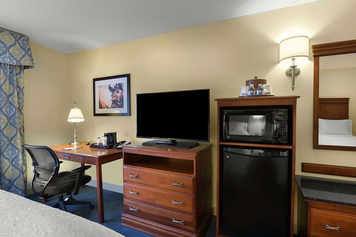 Desk, laptop workspace, blackout curtains, iron/ironing board