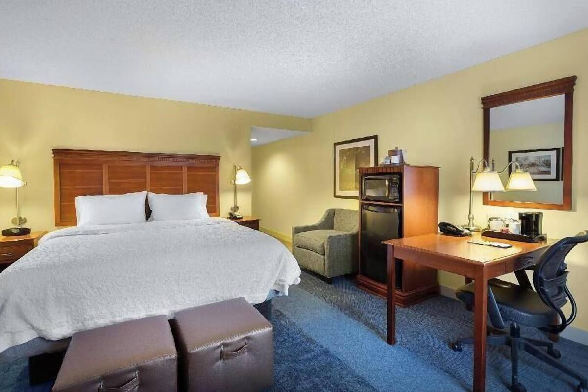 Desk, laptop workspace, blackout curtains, iron/ironing board