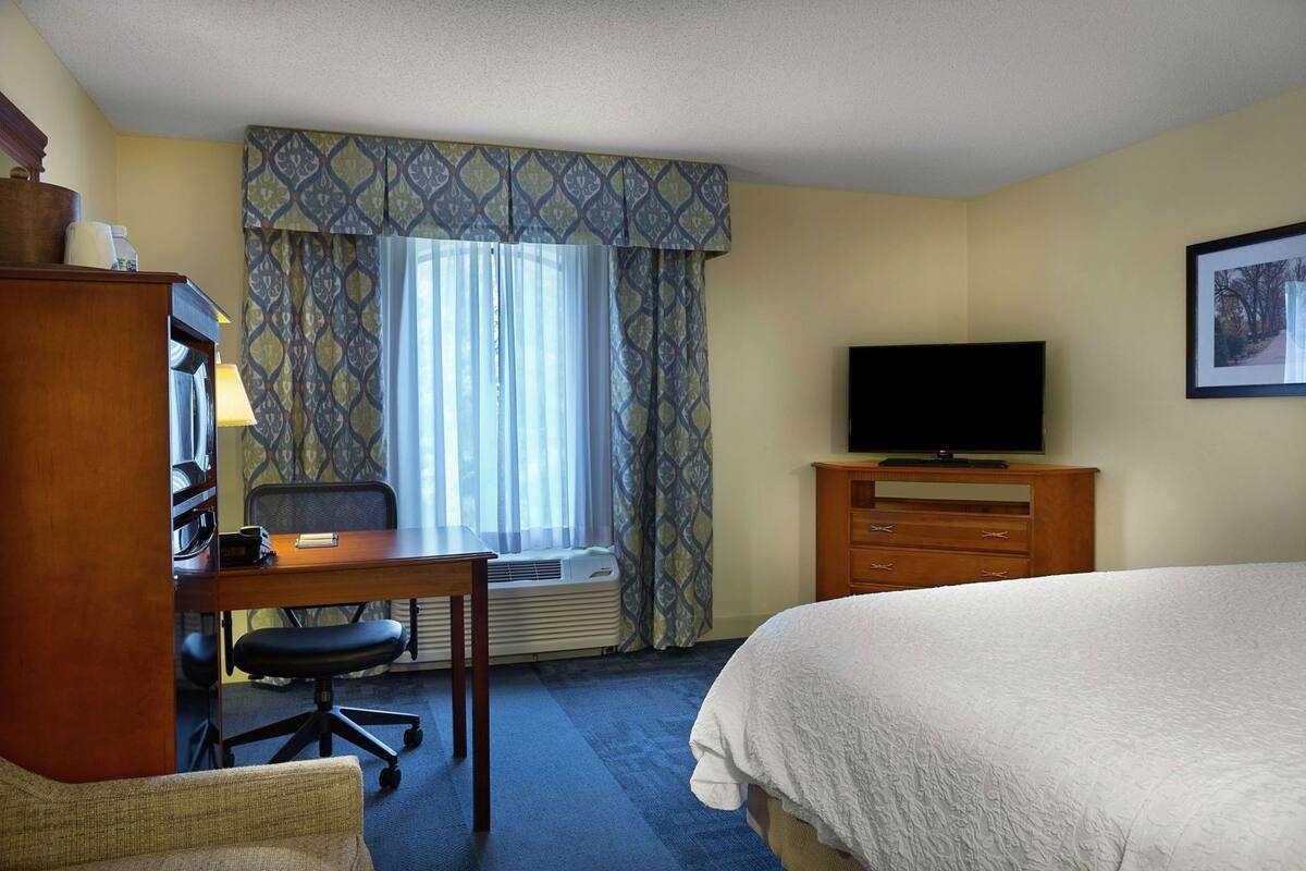 Desk, laptop workspace, blackout curtains, iron/ironing board