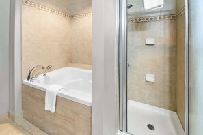 Combined shower/tub, towels - Big Country Hotel & Suites, SureStay Collection by BW (Abilene)