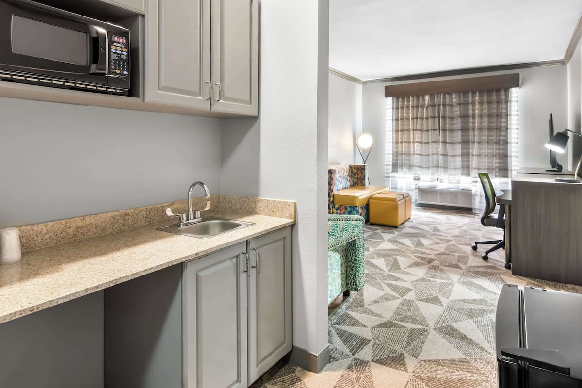 suite, 1 king bed, non smoking, jetted tub (with sofabed) | desk, iron/ironing board, free wifi, bed sheets