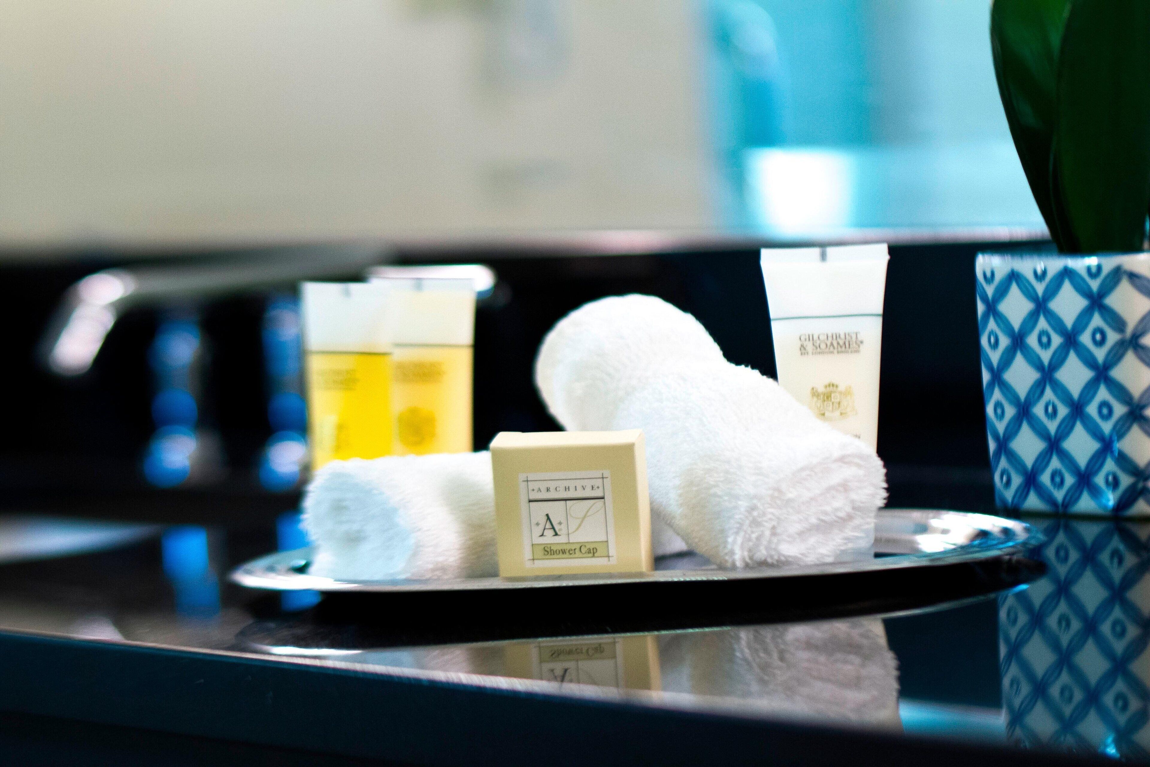 rainfall showerhead, designer toiletries, hair dryer, towels