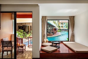 Deluxe Room, Pool Access | Living area | 43-inch LED TV with digital channels, TV, books - Patong Paragon Resort & Spa (Patong)