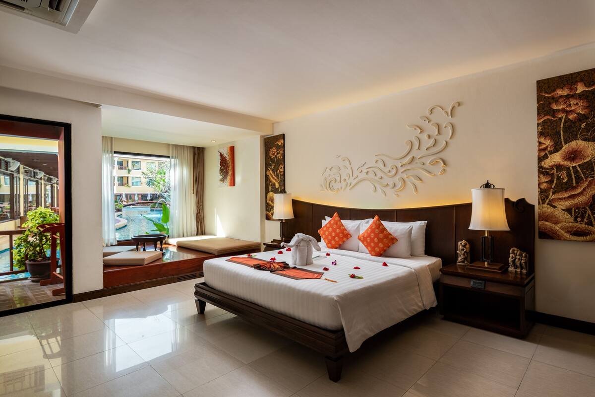 Deluxe Room, Pool Access | In-room safe, desk, laptop workspace, blackout drapes